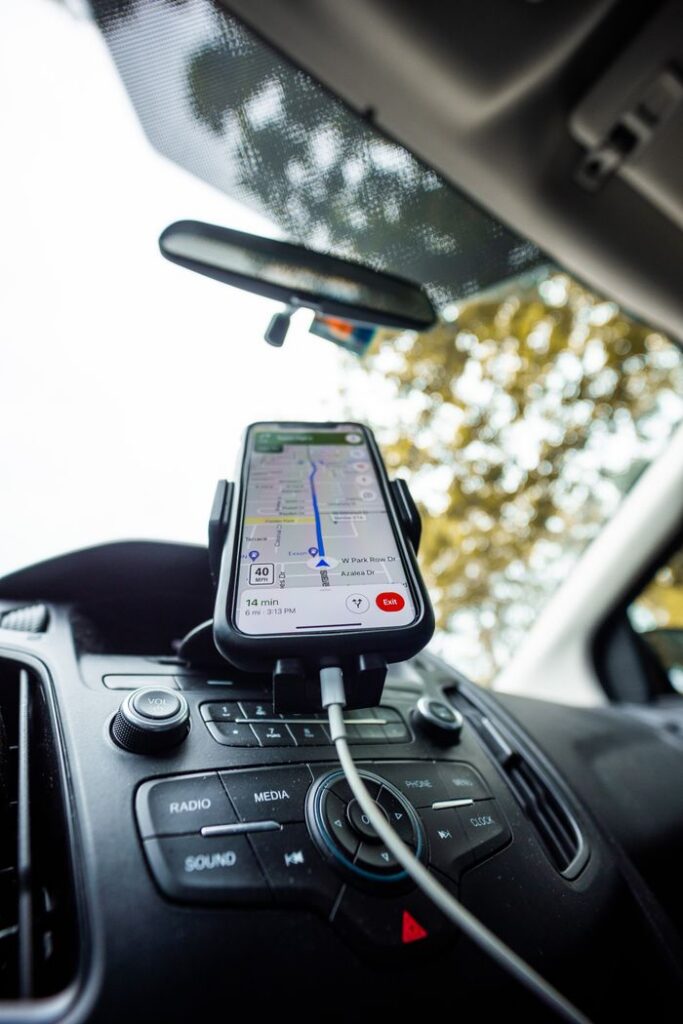pexels photo 7738878 Smartphone mounted on car dashboard running a navigation app. Ideal for travel and technology themes.